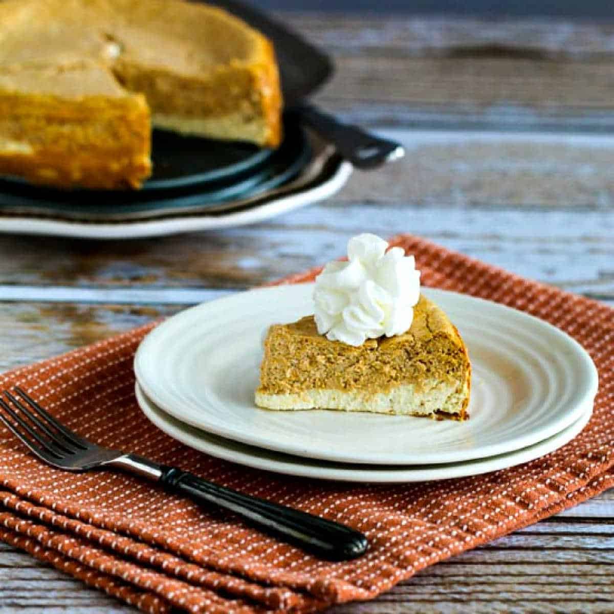 square image for Sugar-Free Layered Pumpkin Cheesecake on serving plate with cheesecake in background