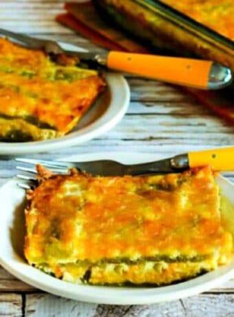 Square image of Chile Rellenos Bake on two plates with baking dishin back.