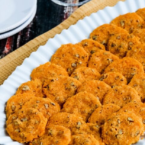 close-up photo of Cheddar Pecan Almond Crisps on serving plate