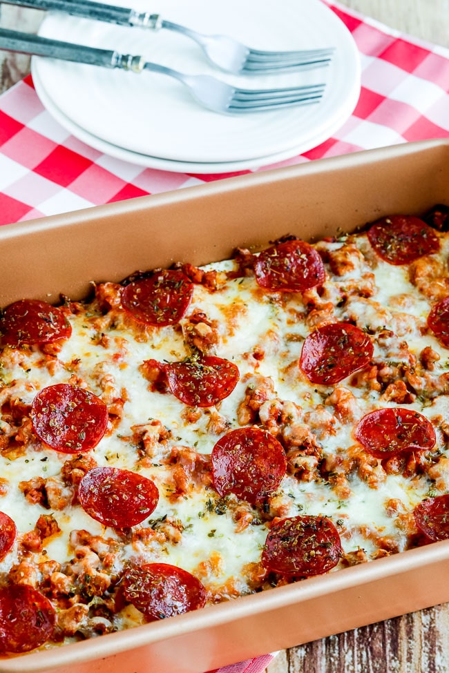 Close-up photo of sausage and pepperoni low carb layered pizza bake