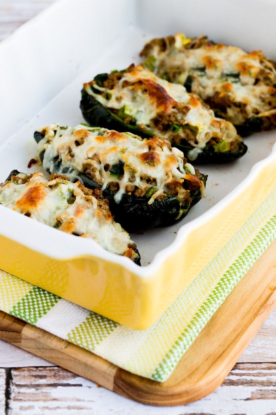 Stuffed Poblanos with Ground Turkey shown in serving dish with melted cheese