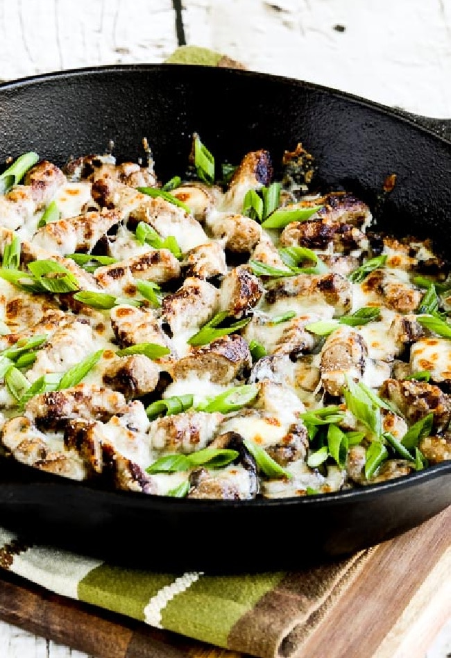 cropped image of Cheesy Low-Carb No-Egg Sausage Mushroom Breakfast in cast-iron pan