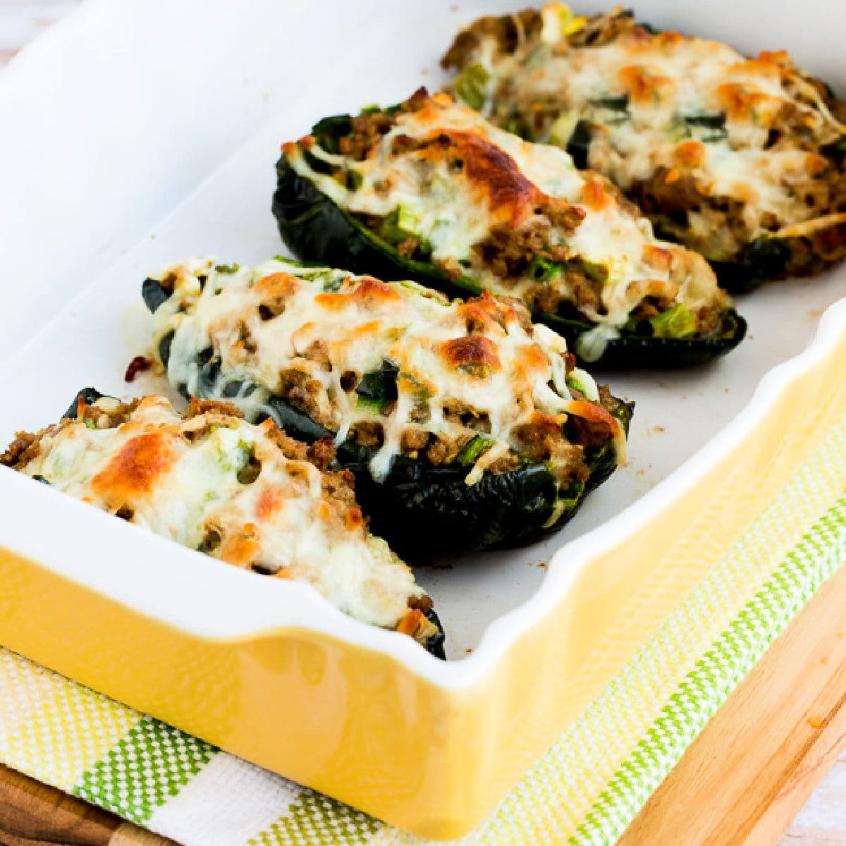 Square image for Stuffed Poblanos with Ground Turkey shown in baking dish.