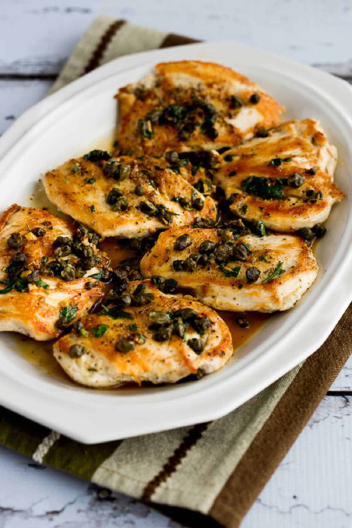 Chicken Piccata with Fried Capers shown on serving plate