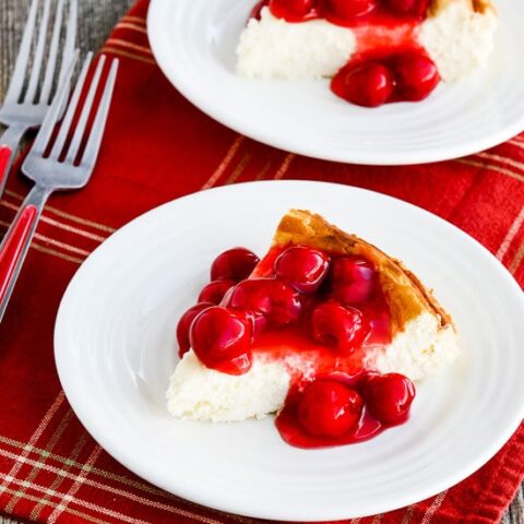 Low-Carb Cheesecake with Cherry Topping on serving plate