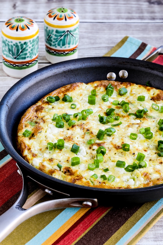 Feta Cheese and Avocado Frittata shown in frittata pan with Mexican salt pepper shakers