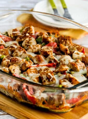 Square image of Sausage, Peppers, and Mushrooms Low-Carb Cheesy Bake in baking dish.