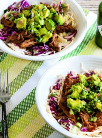 Green Chile Beef Cabbage Bowl shown in two serving bowls with avocado salsa.