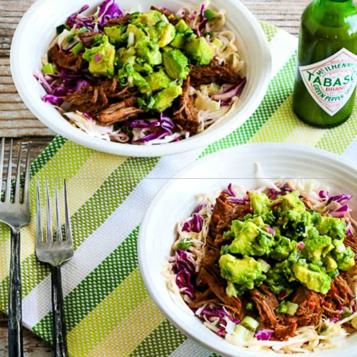 Green Chile Shredded Beef Cabbage Bowl shown in two serving bowls with avocado salsa.