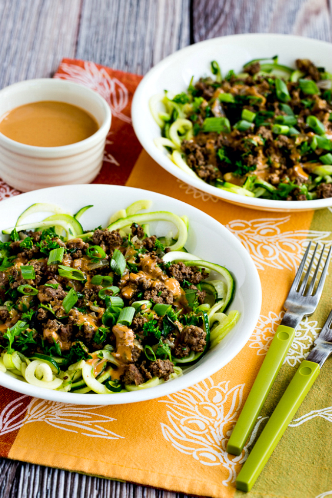 Ground Beef Zucchini Noodles with Peanut Sauce shown in two serving bowls