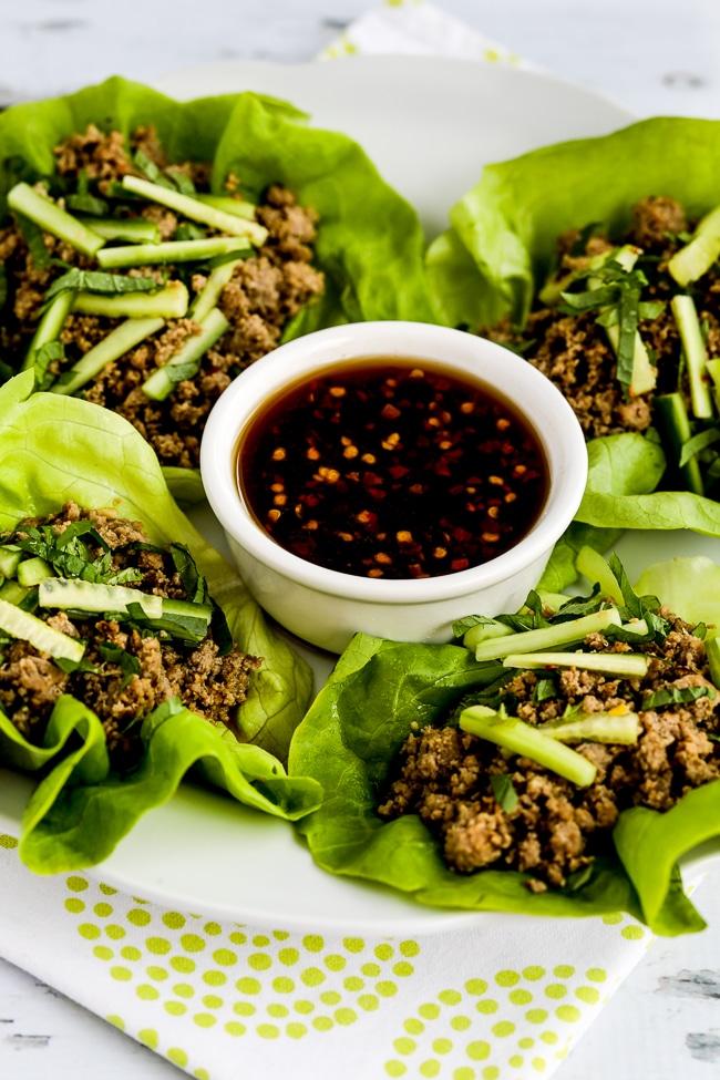 Thai Turkey Lettuce Wraps finished lettuce wraps on serving plate with sauce