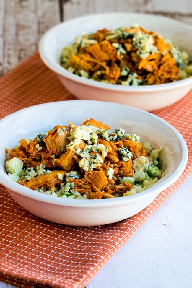 Buffalo Chicken Cauliflower Rice Bowl shown in two serving bowls on napkin.