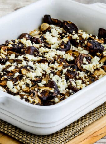 Square image of Balsamic Chicken and Mushrooms shown in baking dish.