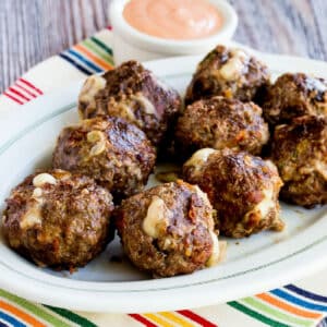 Square image for Bacon Cheeseburger Meatballs shown on serving plate with fry sauce in back.
