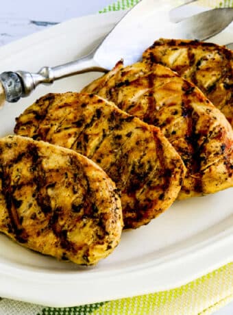Square image of Grilled Tarragon Mustard Chicken shown on serving plater.