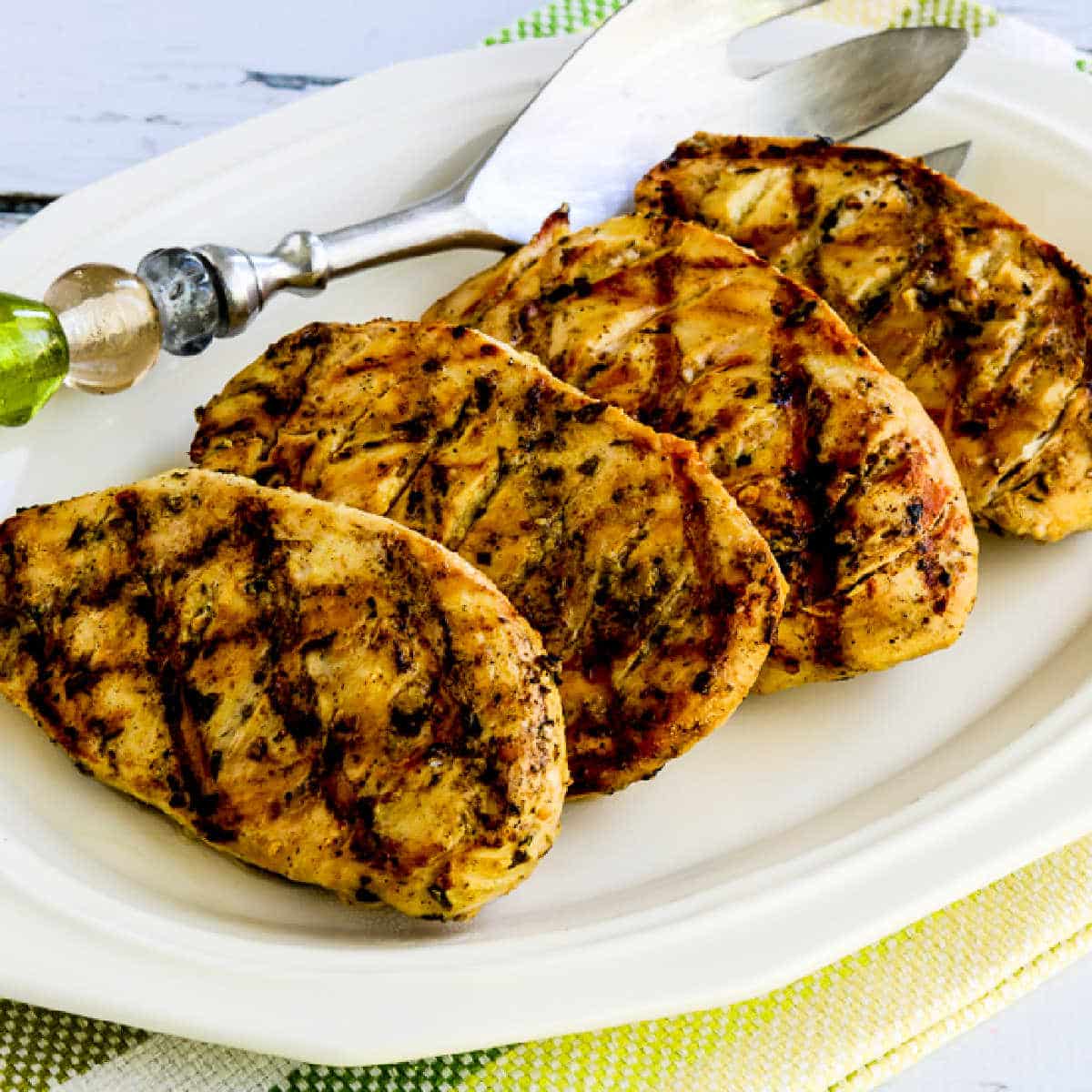 Square image of Grilled Tarragon Mustard Chicken shown on serving plater.
