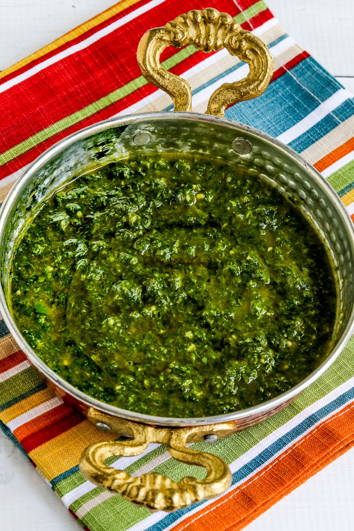 Chermoula Sauce shown in bronze serving dish.