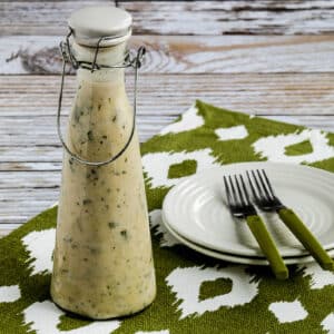 square image of Basil Vinaigrette shown on green-white napkin