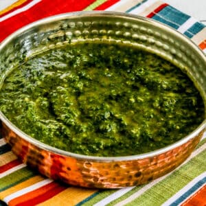 Square image for Chermoula Sauce shown in serving dish on striped napkin.