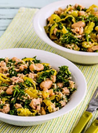 Square image of Cannellini Bean Salad with Tuna and Peperoncini shown in two serving bowls.