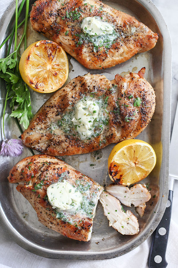 Grilled Chicken Breasts with Chive Herb Butter from FoodieCrush