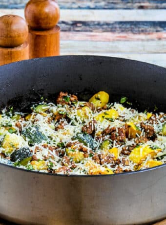 Square image for Italian Sausage and Zucchini Skillet meal shown in skillet.
