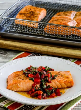Square image for Salmon with Tomato Olive Relish on serving plate with Air Fryer salmon in back.