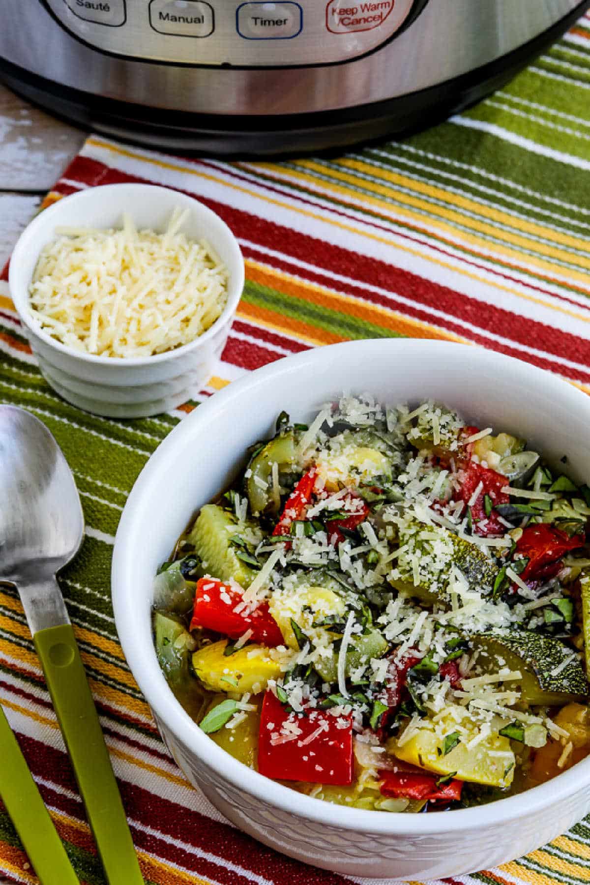 Instant Pot Ratatouille shown on serving bowl with Instant Pot in background