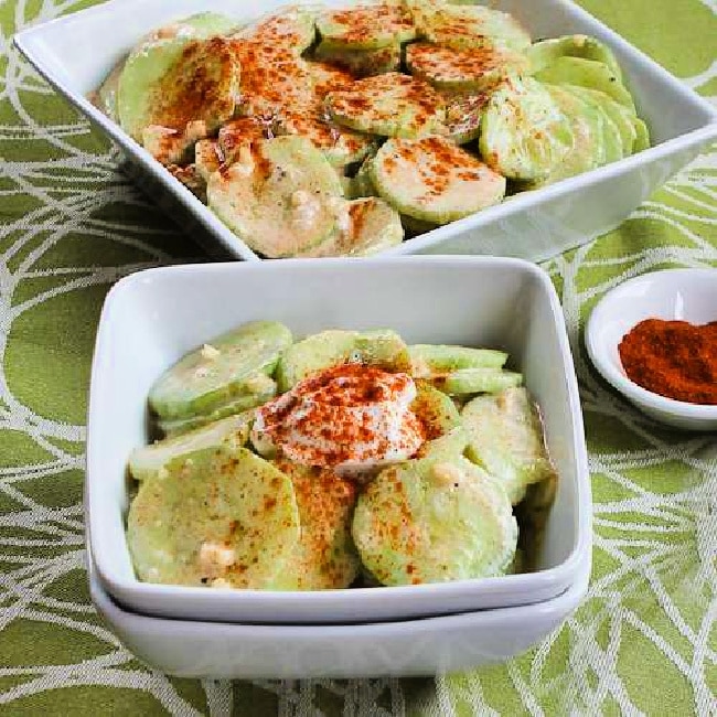 square image of Al's Famous Hungarian Cucumber Salad salad in two bowls with small bowl of paprika