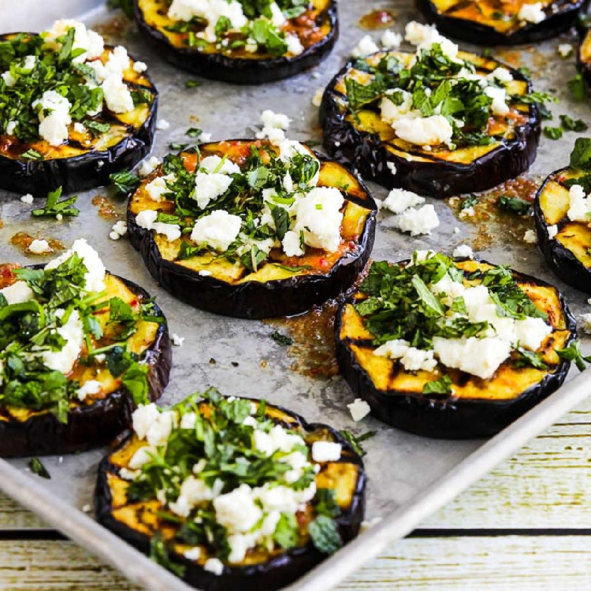 Grilled Eggplant with Feta and Herbs shown on sheet pan.