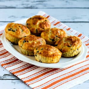 Cottage Cheese Breakfast Muffins with Mushrooms and Feta with six muffins shown on serving platter.