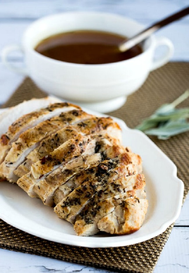 CrockPot or Instant Pot Turkey Breast cropped photo with sliced turkey on plate and gravy in background
