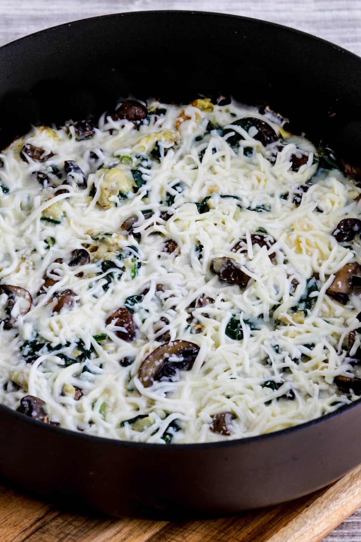 Mushroom Lover's Egg Skillet with Spinach close-up photo of egg skillet in pan