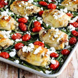 square image of Greek Chicken, Green Beans, and Tomatoes Sheet Pan Meal shown on sheet pan