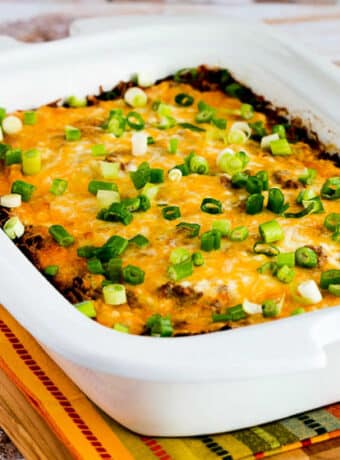 Square image of Slow Cooker Mexican Lasagna Casserole shown in Casserole Crock Pot.