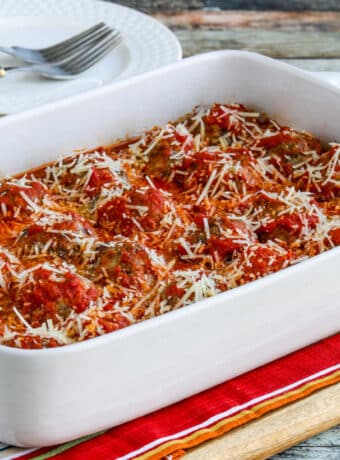 Square image for Beef and Sausage Meatballs in Tomato Sauce shown in baking pan.