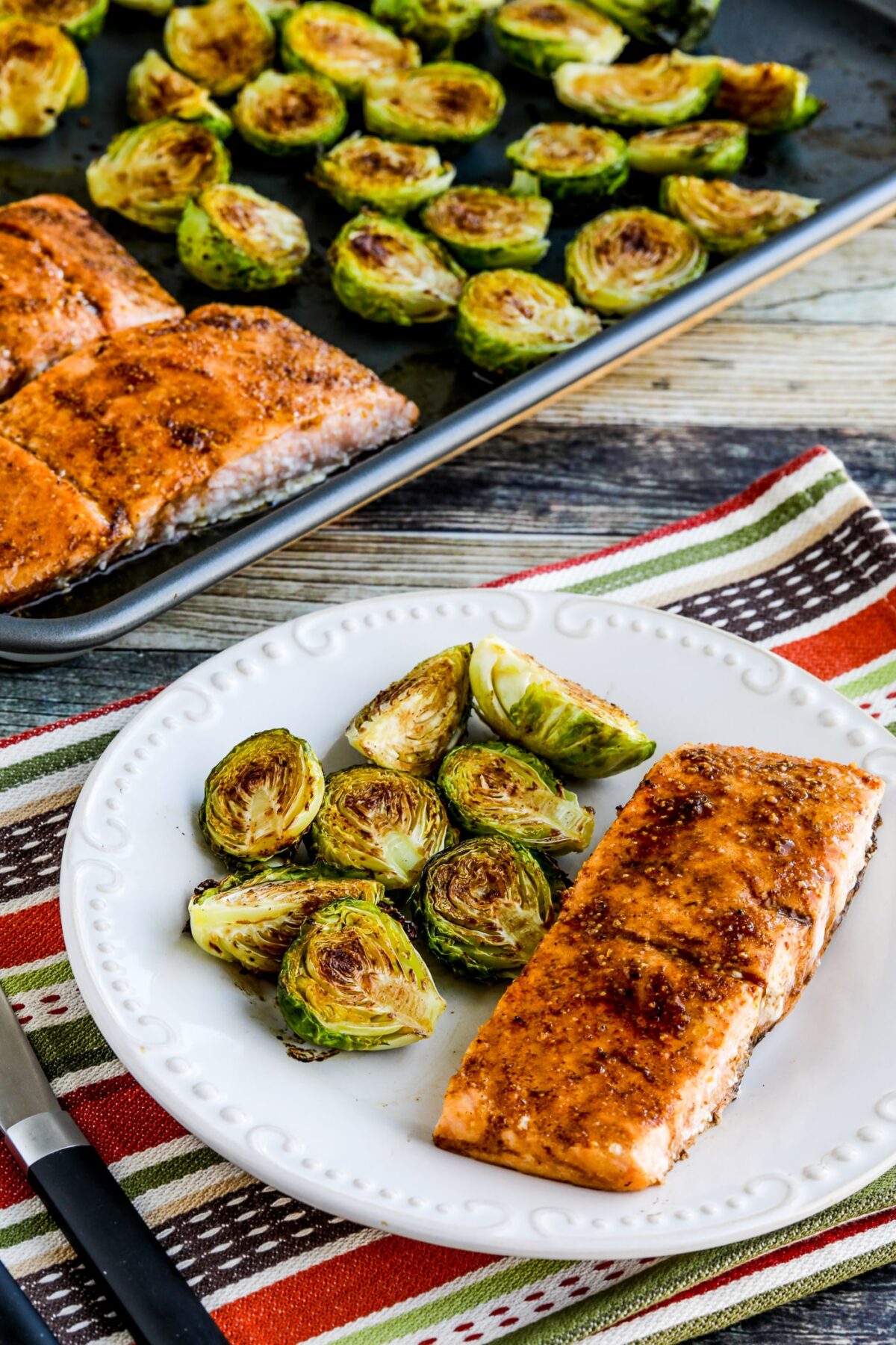 Brussels Sprouts Salmon Sheet Pan Meal shown on baking pan.
