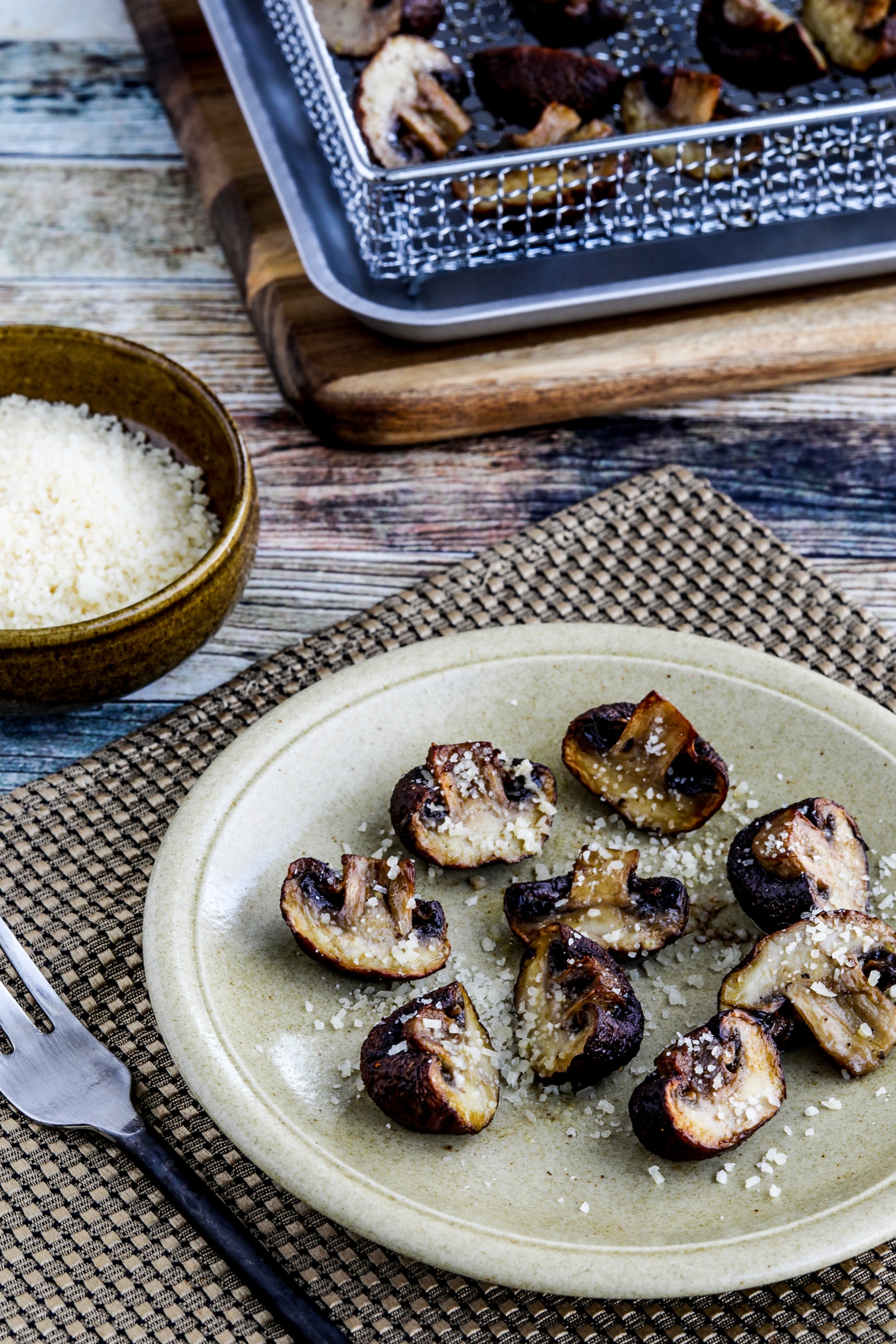 Air Fryer Roasted Mushrooms close-up photos of one serving with Parmesan and Air Fryer in background