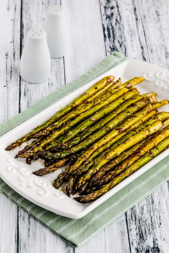 Easy Roasted Asparagus on platter with towel underneath