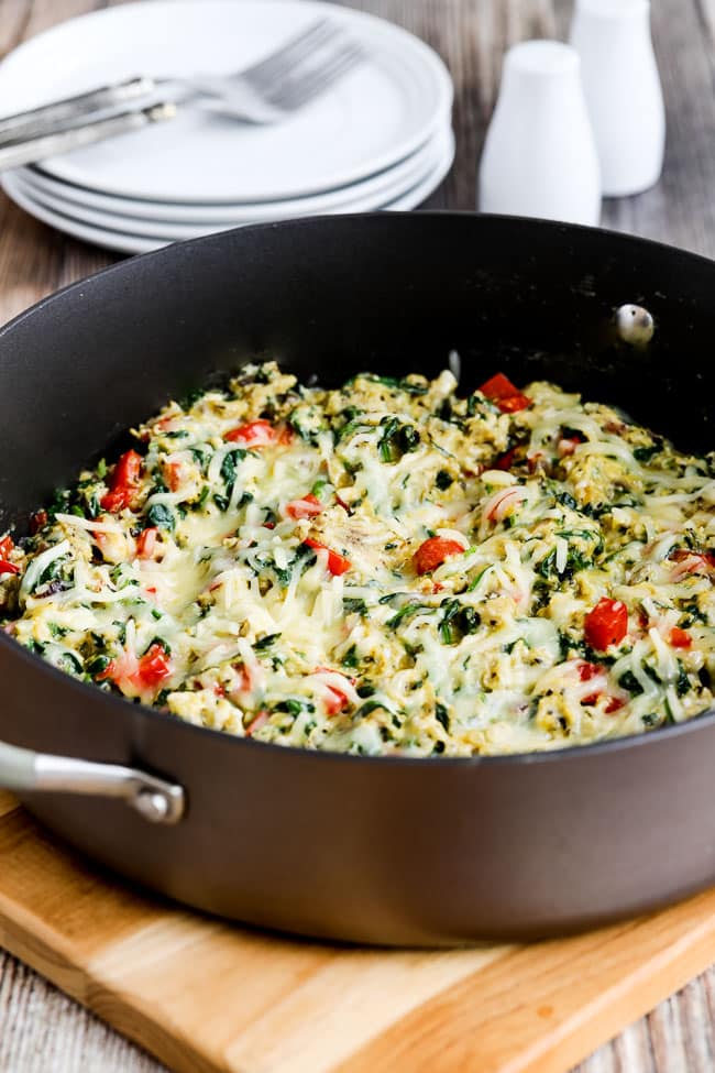 Power Greens Egg Skillet shown in pan with plates, forks in background