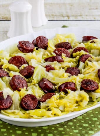 Instant Pot Cabbage and Sausage shown on serving platter.