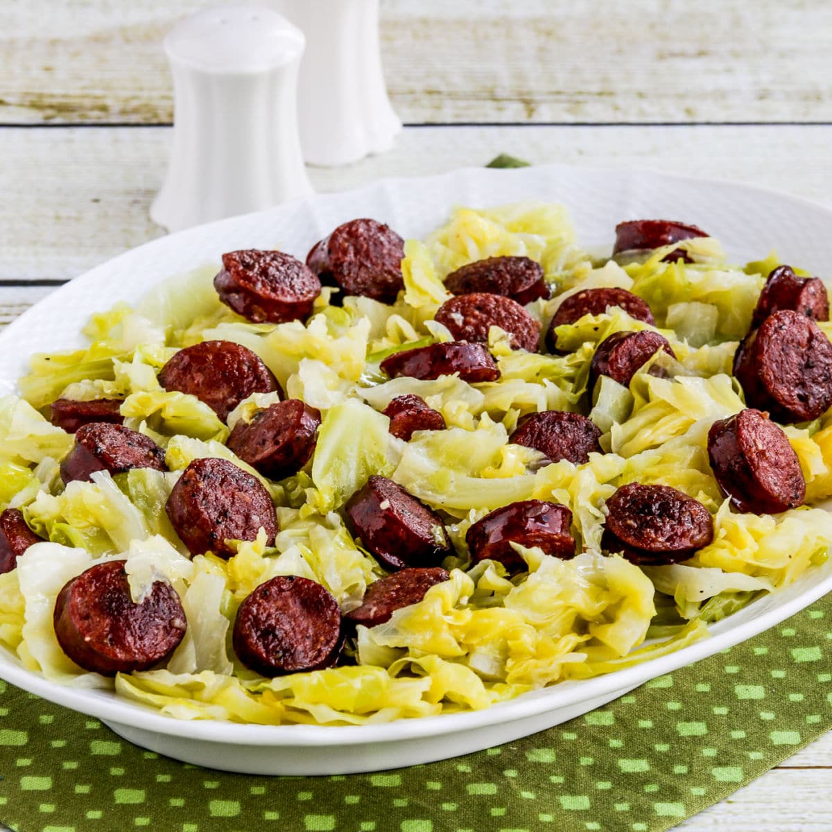 Instant Pot Cabbage and Sausage shown on serving platter.