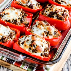 Square image for Beef, Sausage, and Cabbage Stuffed Peppers shown in baking dish.
