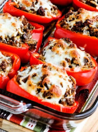 Square image for Beef, Sausage, and Cabbage Stuffed Peppers shown in baking dish.