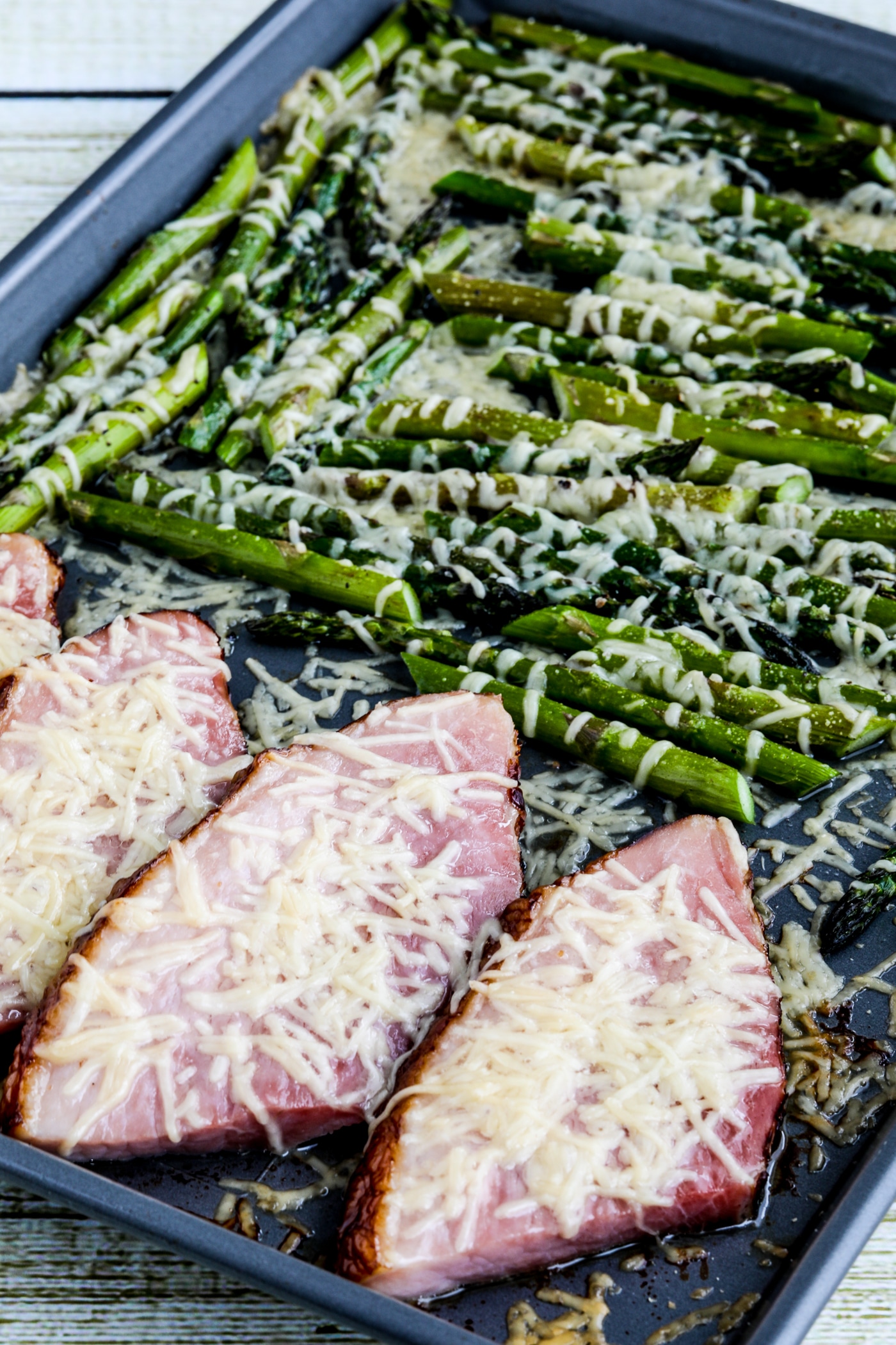 Easy Cheesy Baked Ham and Asparagus finished dish on sheet pan