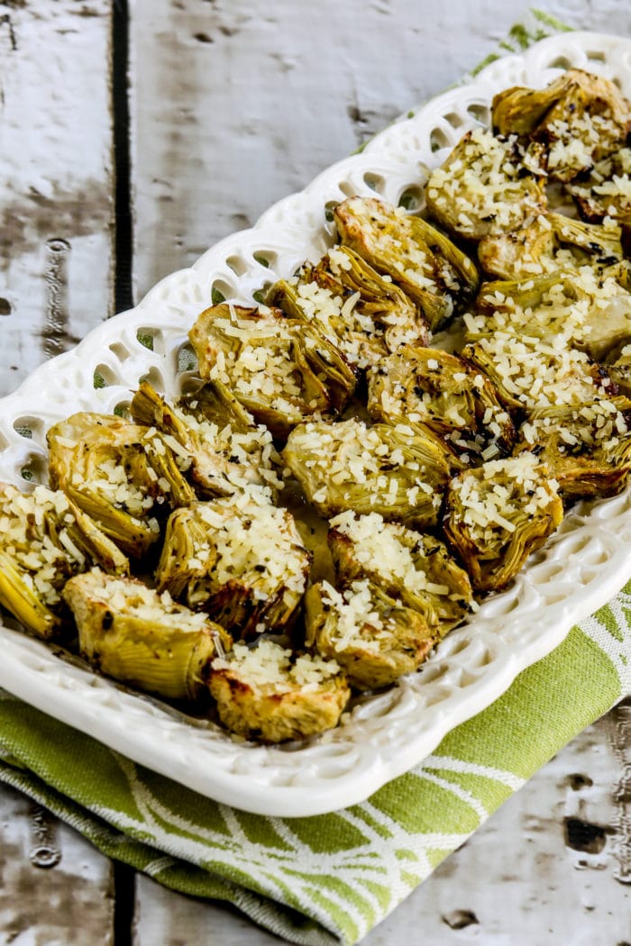 Air Fryer Artichoke Hearts appetizer on serving plate with grated Parmesan