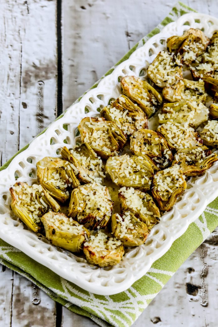 Air Fryer Artichoke Hearts cooked artichoke hearts on serving plate with grated Parmesan