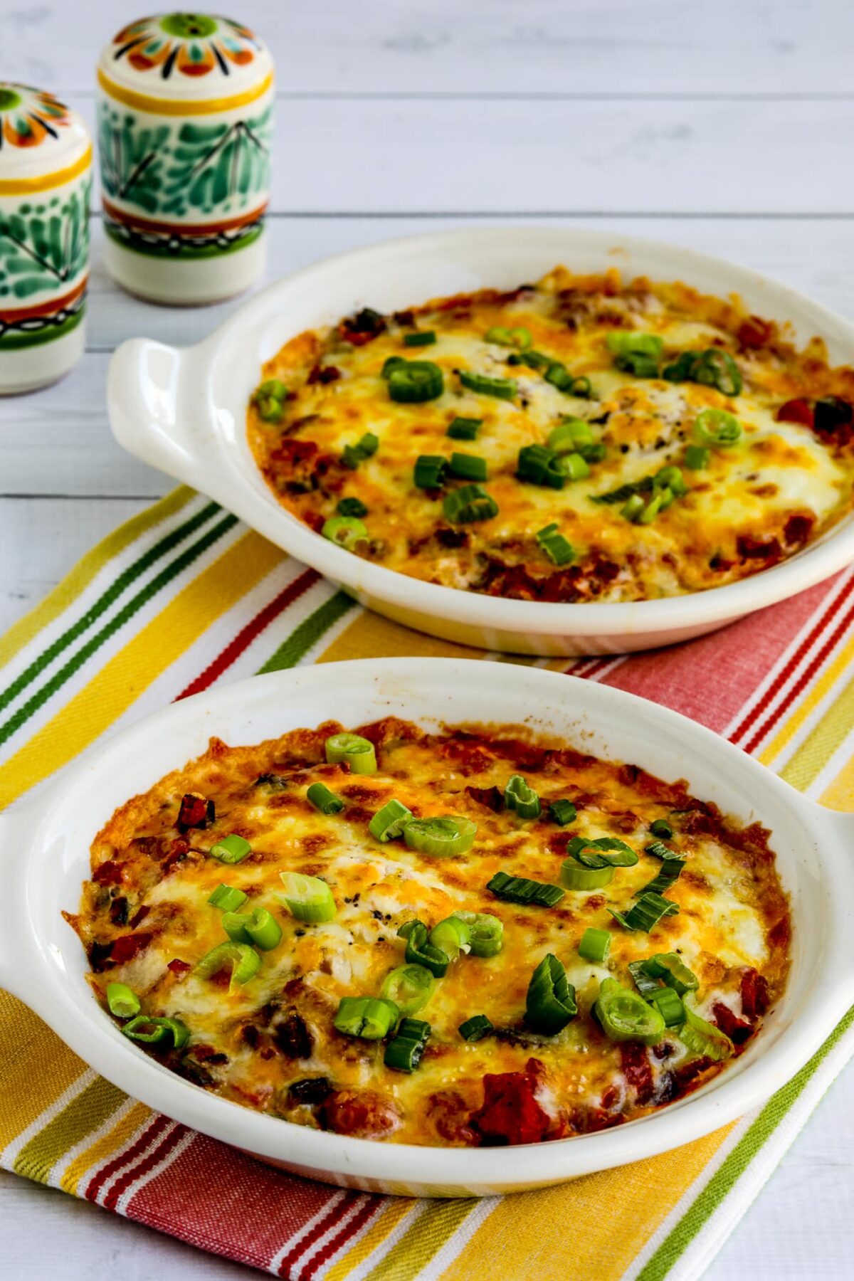 Mexican Baked Eggs shown in two small baking dishes