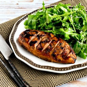 Grilled Chicken with Balsamic Vinegar shown on serving plate with arugula salad.