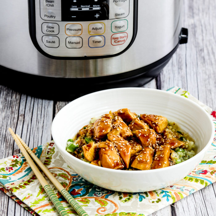 Instant Pot Teriyaki Chicken thumbnail image of chicken in rice bowl with Instant Pot in back